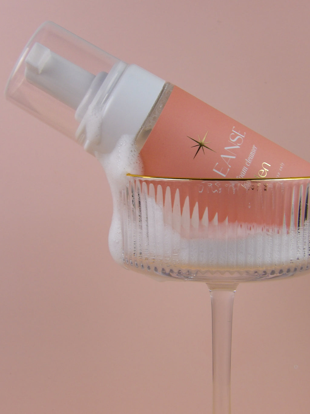 pump bottle with a pink background