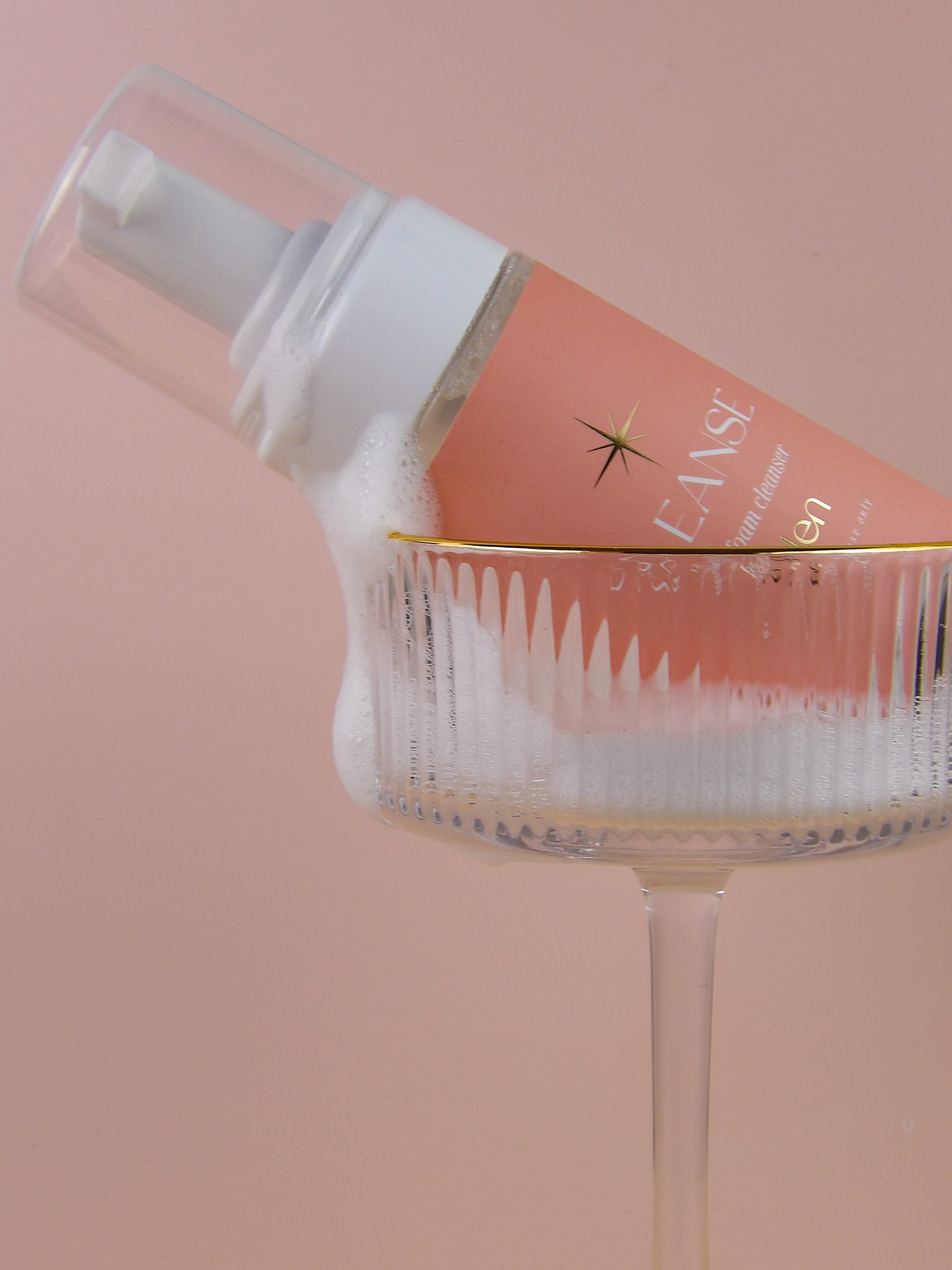 pump bottle with a pink background