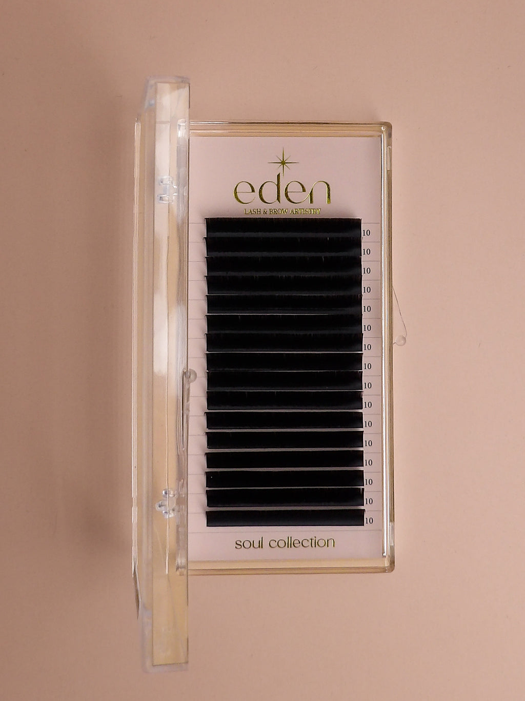 Eden eyelash packaging with false eyelashes on a beige background
