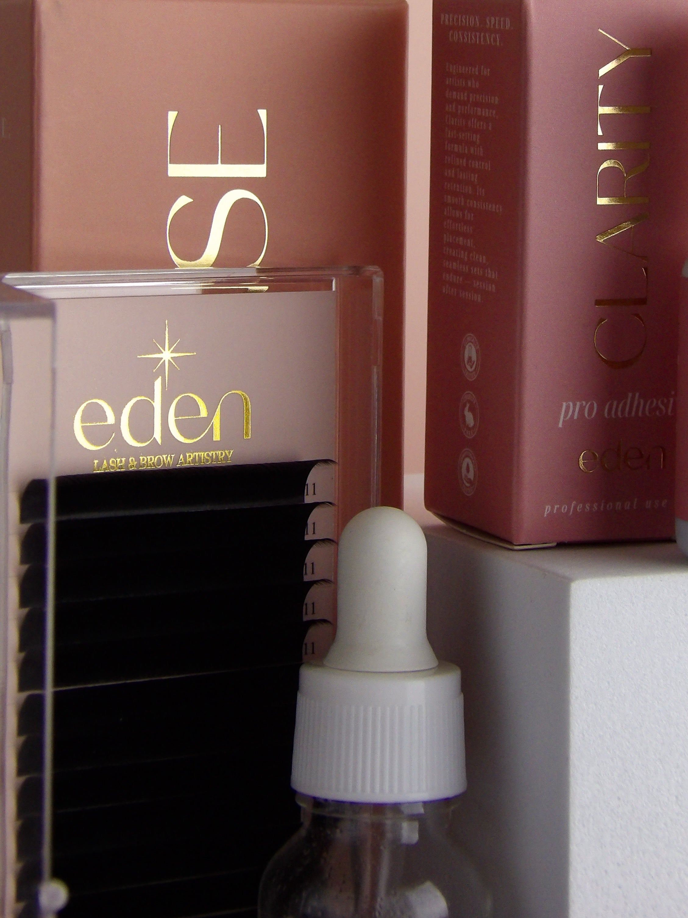 Bottle with a dropper and 'eden' branding on a shelf.