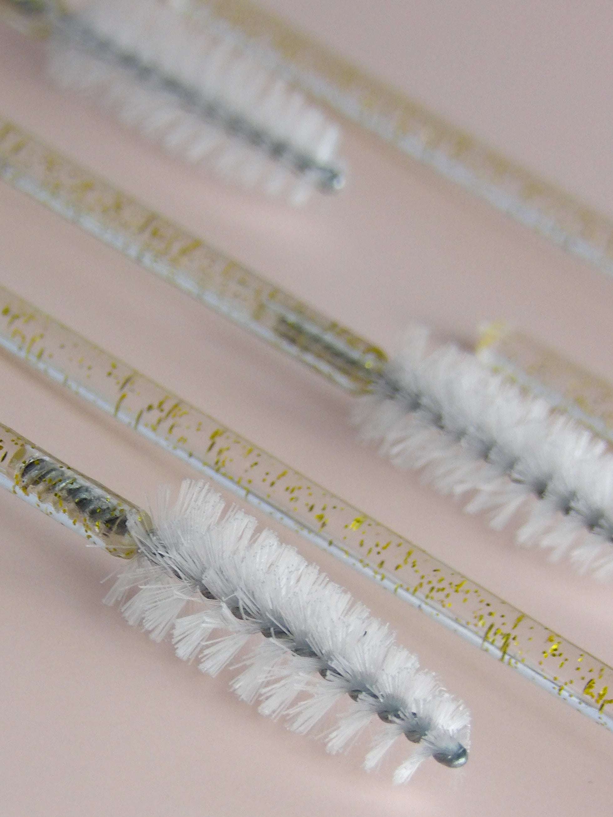Close-up of a set of eyelash extensions on a neutral background